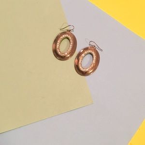 Golden dangling hoops